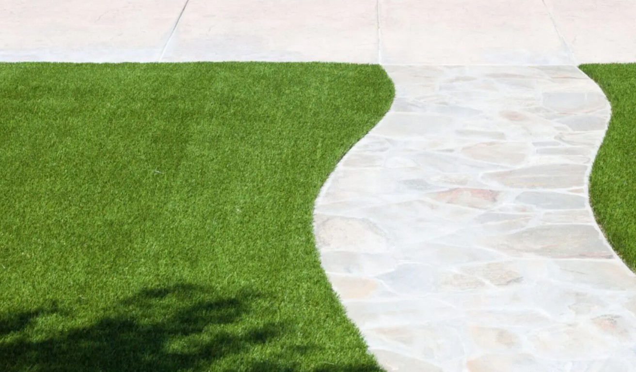 Clean, mud-free artificial grass walkway in Porterville home